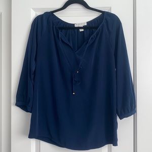 Forever 21 navy blouse with small v neck and tie.